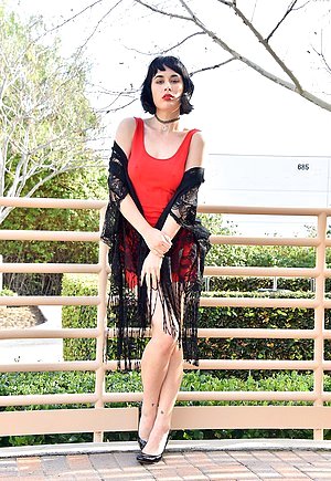 Short-haired mature brunette flashing her pubes while out and about